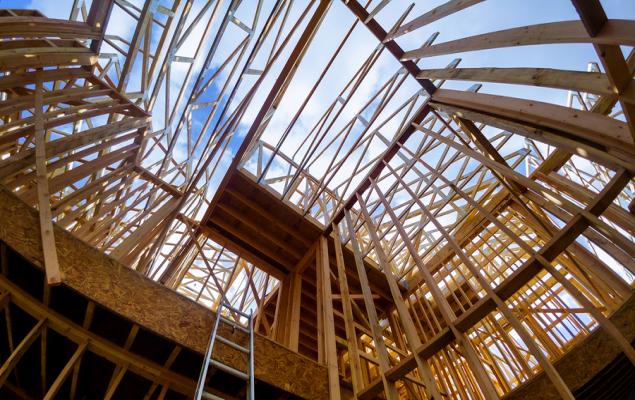 Construction site with cranes and buildings under development, representing urban construction.