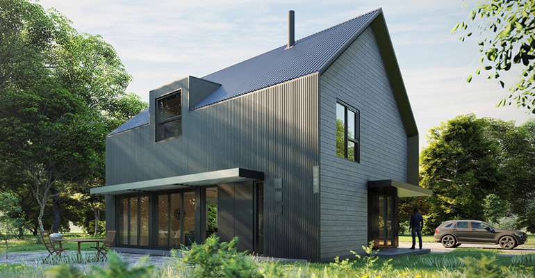 Construction site at dusk or dawn with illuminated buildings and cranes, showing urban development.