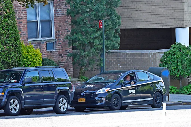 Building inspector examining a construction site, focusing on safety and compliance.